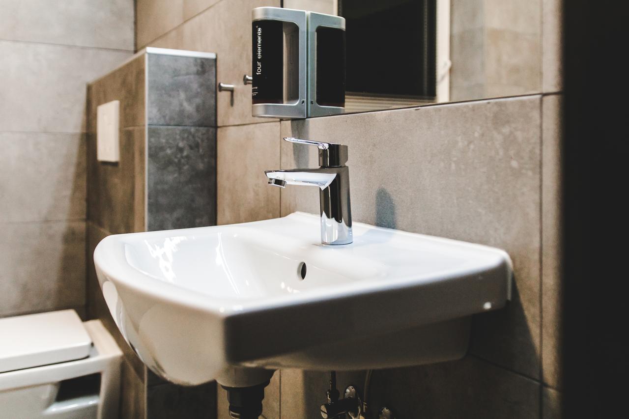 Silesia Residence Ostrava Kültér fotó A soap dispenser mounted above a sink